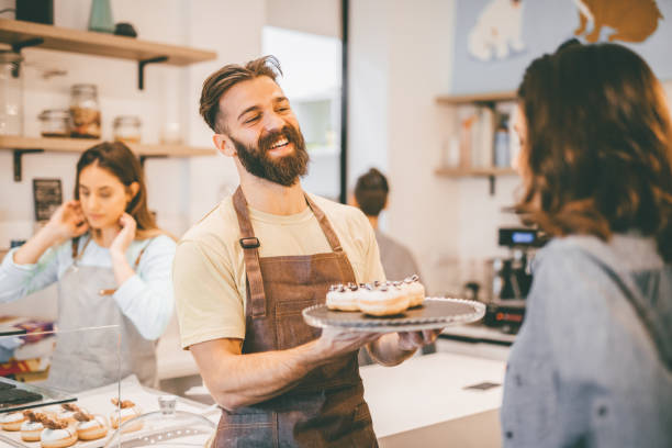 istock Woman buying donuts 913750136