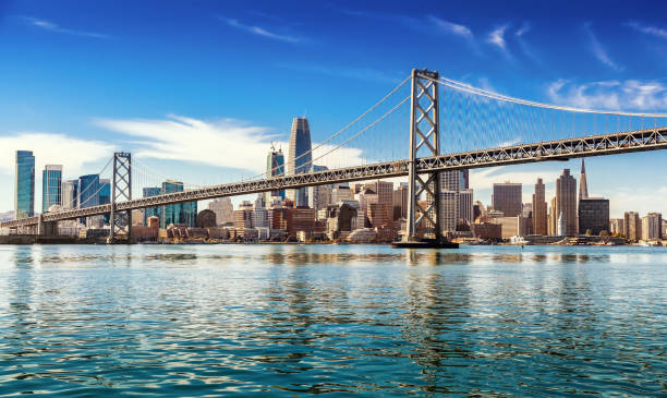 San Francisco on sunny day Downtown San Francisco and Oakland Bay Bridge on sunny day promenade photos stock pictures, royalty-free photos & images