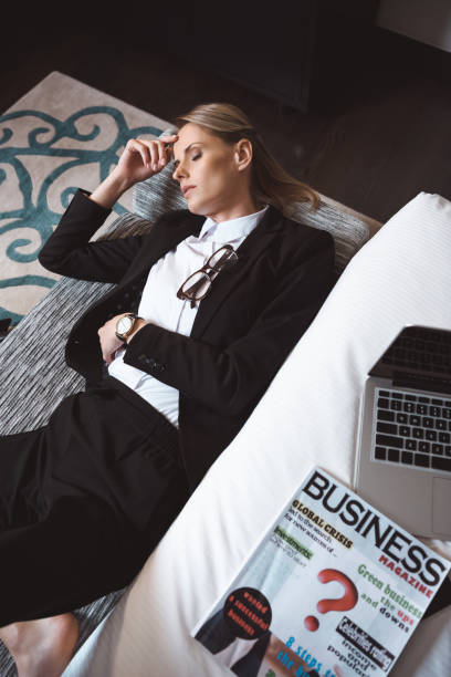 istock businesswoman sleeping in hotel room 913756090