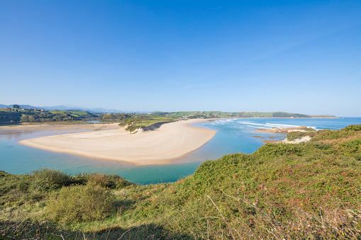 landscape high view of famous beach named Oyambre and Cantabrian Sea, in San Vicente de la Barquera, Cantabria, Spain, Europe