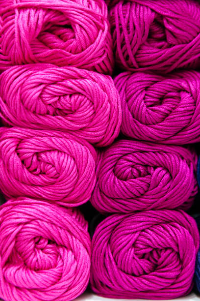 istock scale of pink wool yarns organized by color 913757848