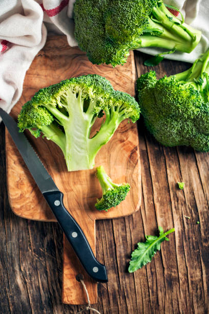 istock Fresh broccoli on wooden cooking board 913759622