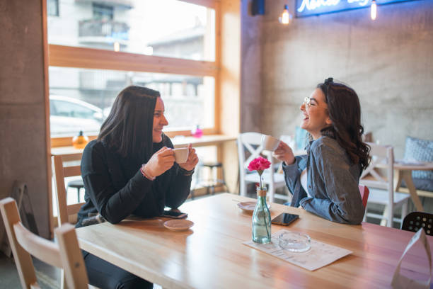 istock Two girl friends in cafe 913759718