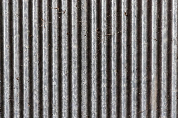 istock Old dirty zinc fence and spider web Light on left 913765688