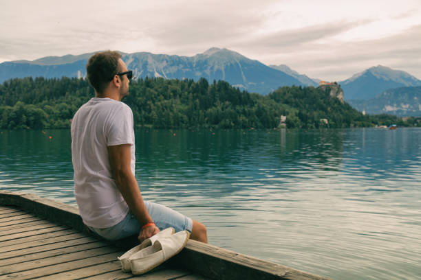 istock Tourist handsome man enjoying the view in nature. 913768658