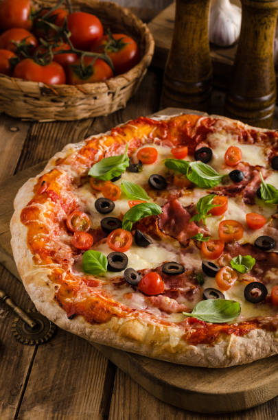 istock Rustic pizza with tomato, cheese, salami 913769374