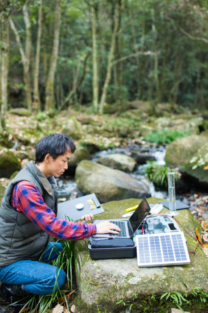 istock A scientist monitoring water quality from a solar powered field laboratory 913769924