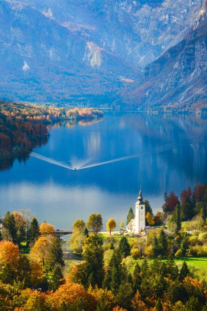 Aerial view of Bohinj lake in Julian Alps, Slovenia Aerial view of Bohinj lake in Julian Alps. Popular touristic destination in Slovenia. julian alps stock pictures, royalty-free photos & images