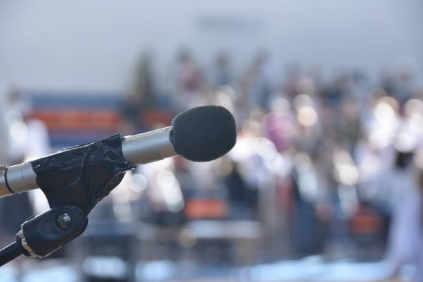 istock Microphone and defocused audience waiting for the show to begin 913770712