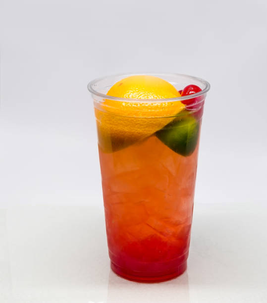 istock Fresh Squeezed Fruit drink with lemon, orange, lime and cherries in a clear plastic cup. 913773372