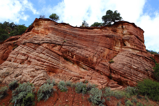 Cross bedding in the Entrada sandstone; a Triassic/Jurassic rock formation formed by aeolian transported sand which resulted into dune deposits over geologic time, Kanab, Utah, USA