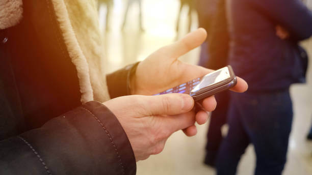 istock A man reads a message on the phone screen 913778172