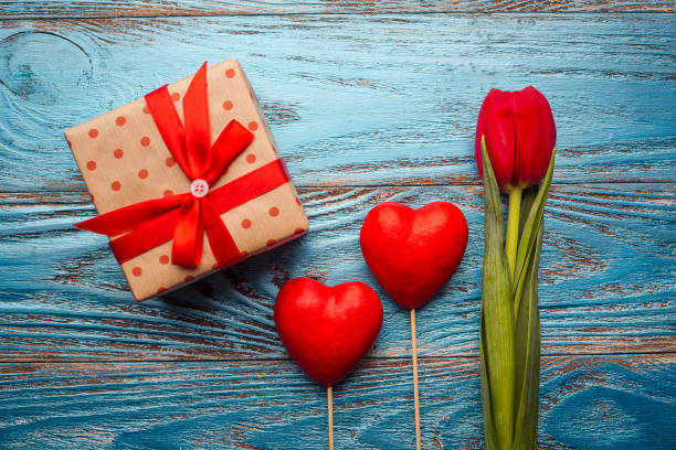 istock Valentines day background decorated with red hearts/copy space 913778274