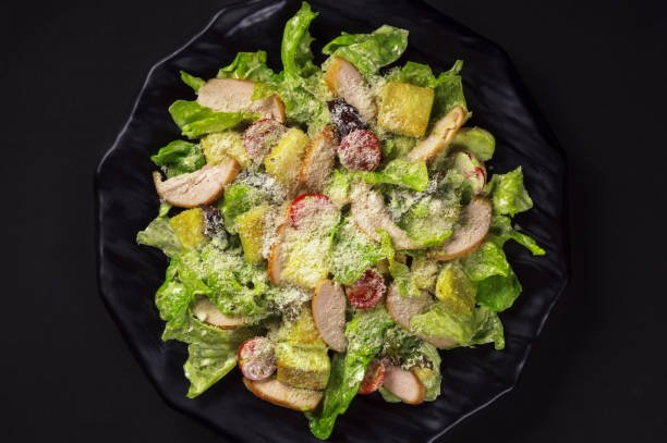 salad caesar with chicken - parmesan cheese chicken veal salad imagens e fotografias de stock