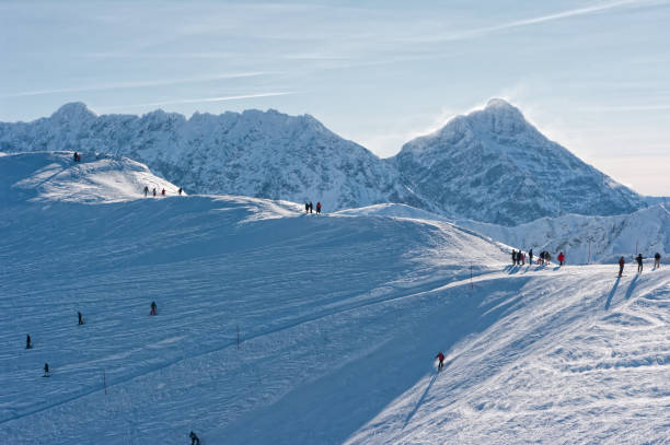 istock People on the snow-covered mountain peaks and rocky peaks. 913796376