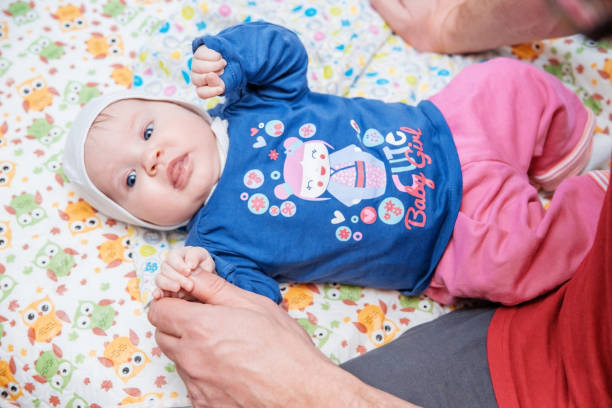 istock The baby is lying on the blanket next to dad dad. 913805366
