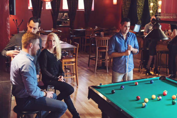 istock Coworkers hanging out in a bar 913807718