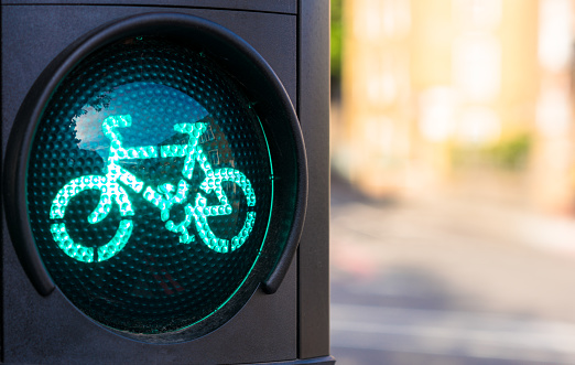 Close-up of a green traffic light for cyclists.