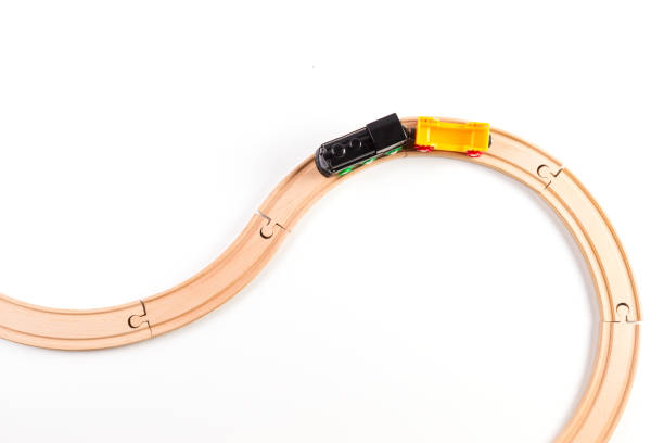 istock Toy train on curve wooden railways. Top view. 913819692