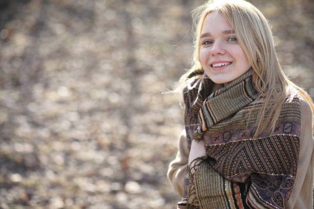 istock Cute blonde in a city park 913828322