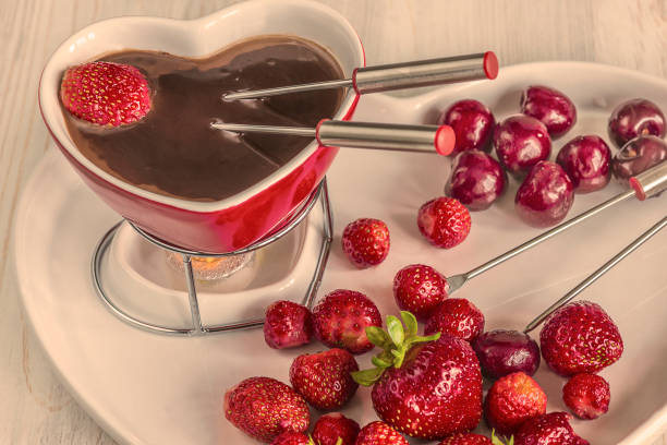 istock chocolate fondue with strawberries and cherries 913838776