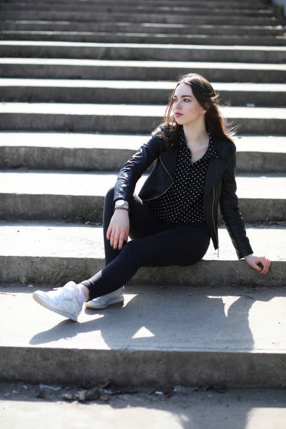istock Girl on a walk through the spring city 913839190