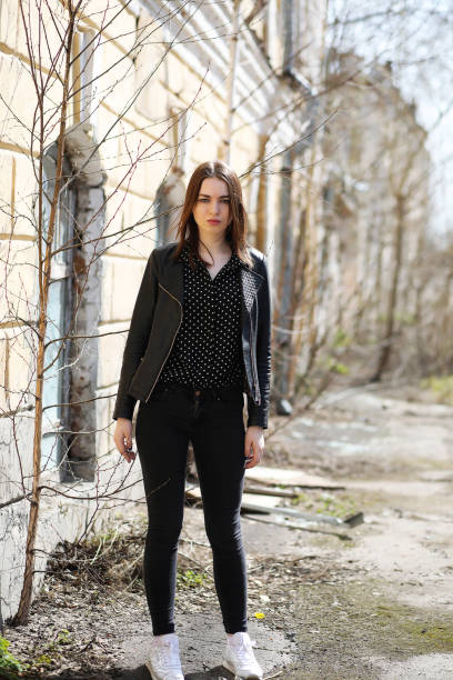 istock Girl on a walk through the spring city 913839624