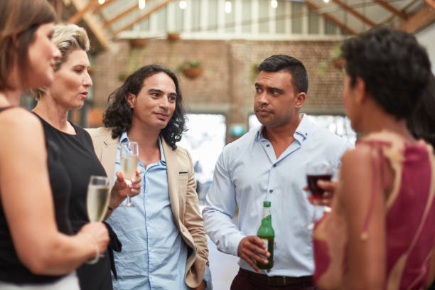 istock Group of business people having drinks after work 913840196