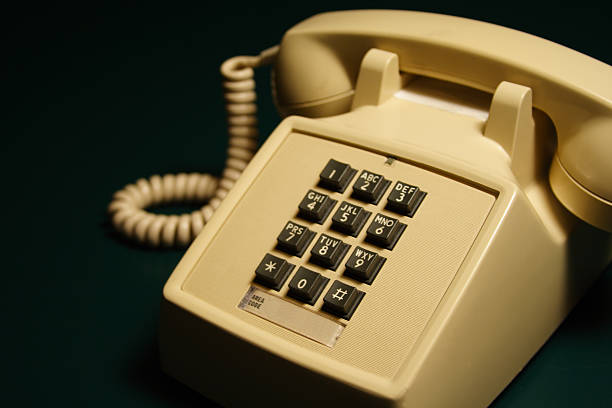 istock 1970s / 1980s Push Button Telephone on Green 91384044
