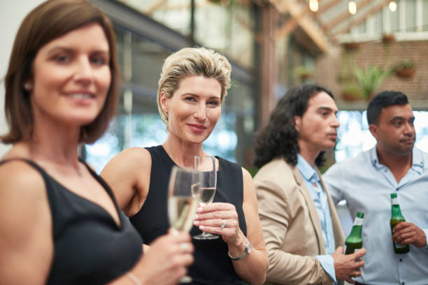 istock Businesswomen enjoying drinks after work 913840464