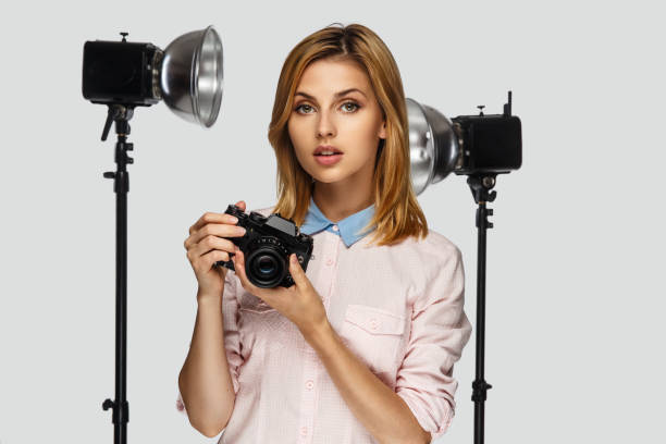 istock Blond female photographer. 913843402