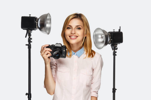 istock Blond female photographer. 913847472