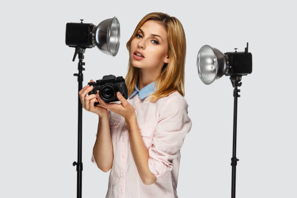 istock Blond female photographer. 913849652