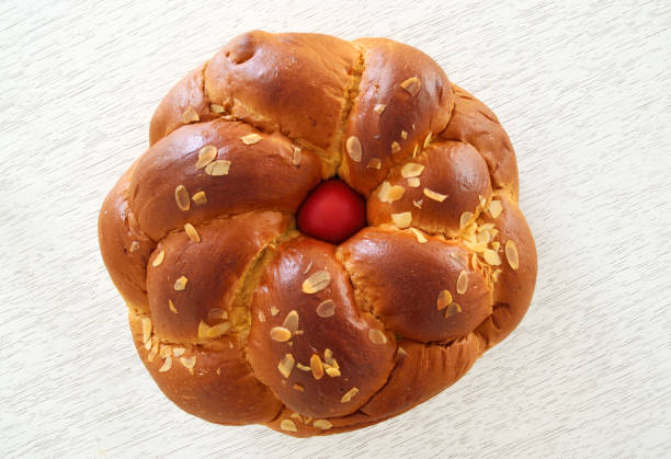 istock Traditional Easter bread ,tsoureki with red egg in the middle 913849814