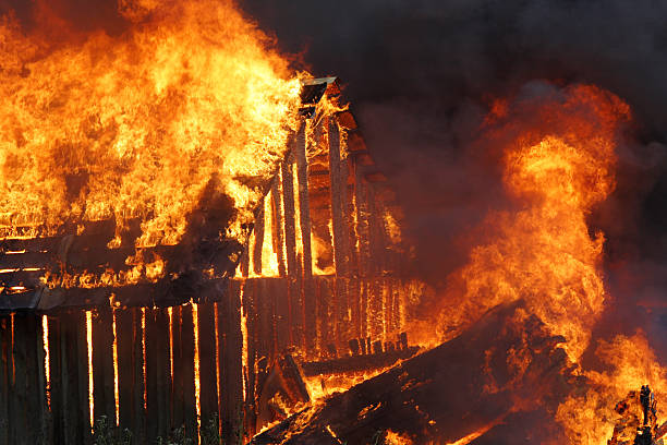 Burning wooden house stock photo