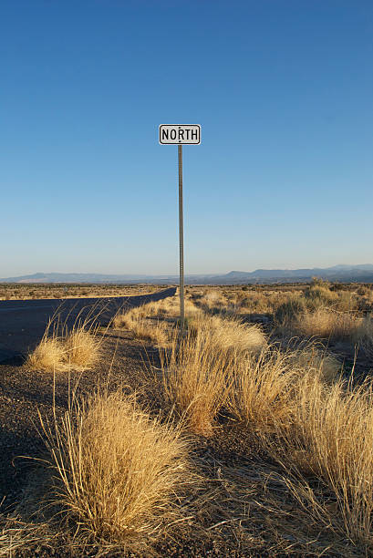 istock north sign, blue sky, and desert landscape sunrise 91385555