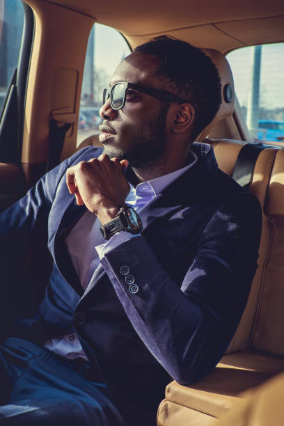 istock Stylish black man in a car. 913857698