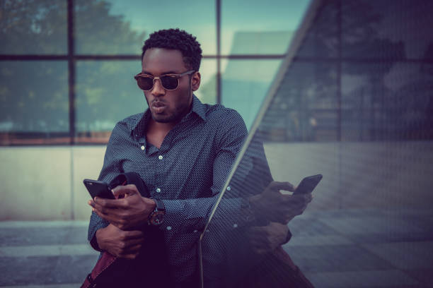 istock African american male using smartphone. 913858004