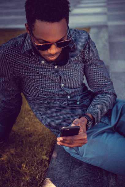 istock African american male using smartphone. 913858390