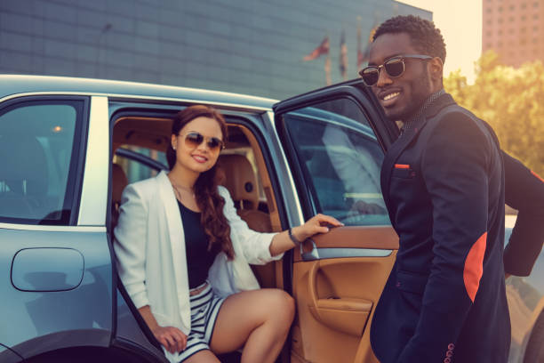istock Casual couple posing near a car. 913861846