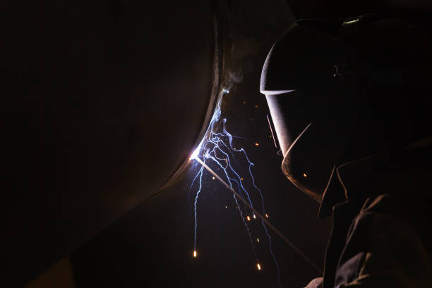 Arc welder Arc welder at work welding helmet stock pictures, royalty-free photos & images