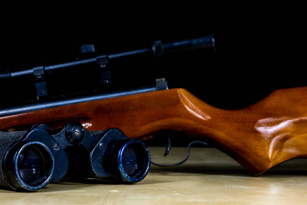 Close up modern sniper rifle, military conflict, concept of war.