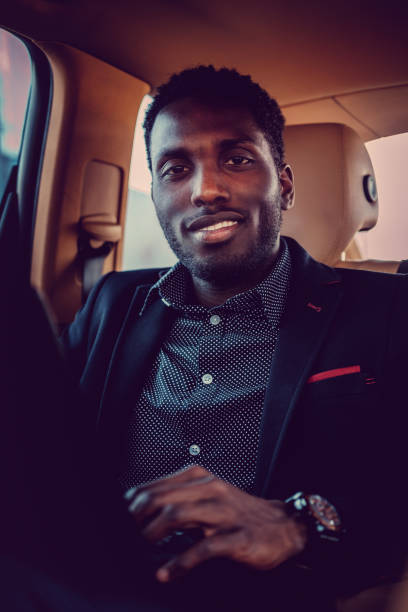 istock Smiling black man in a car. 913866050