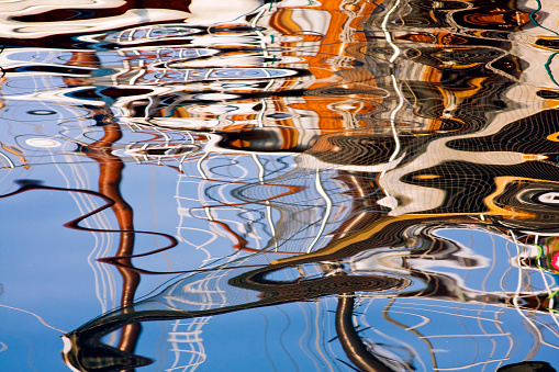 reflection of sailing boat on the sea surface