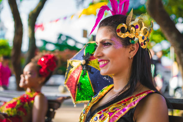 istock Dancers holding colorful umbrellas 913873936