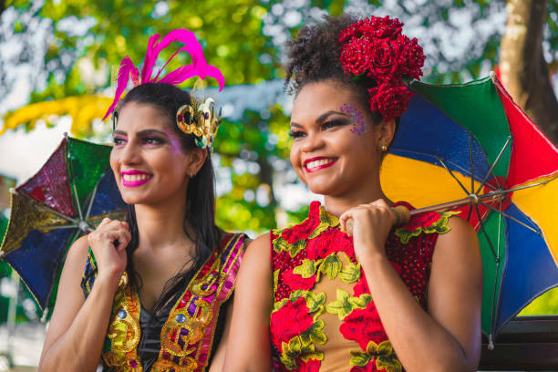 istock Dancers holding colorful umbrellas 913873990