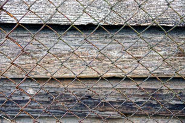 istock texture of rusty mesh and wooden boards 913876602