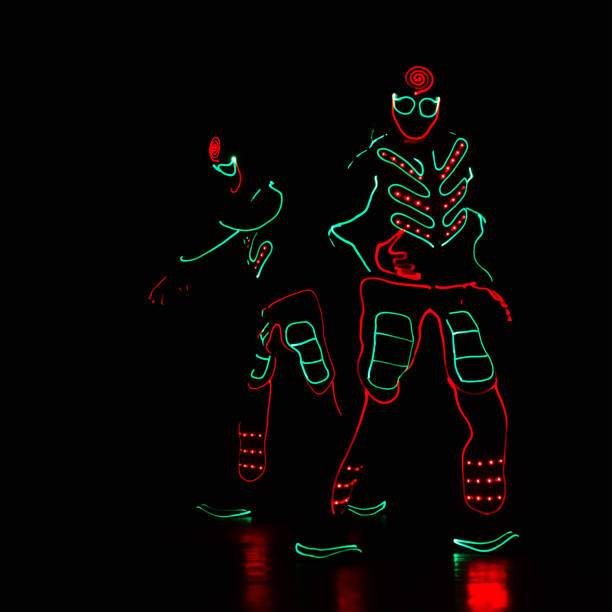 istock dance team in costumes of the LED 913879342