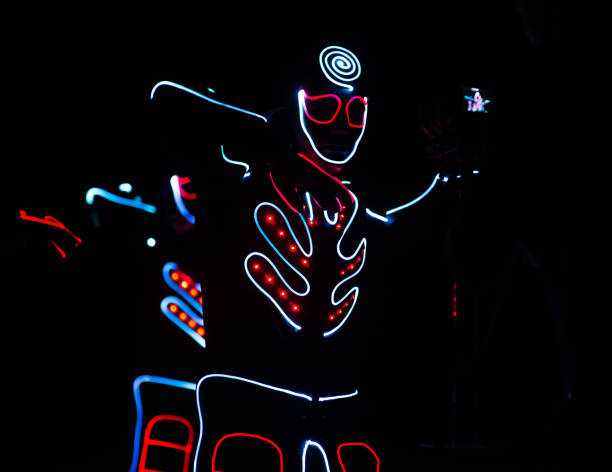 istock dance team in costumes of the LEDs 913879344