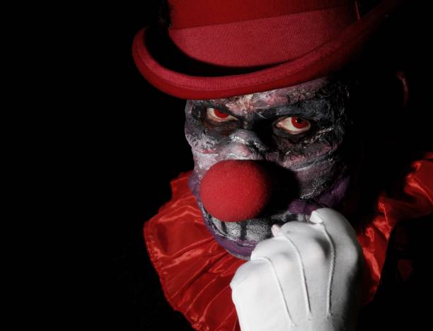 istock Scary clown shaking his fist 913879672